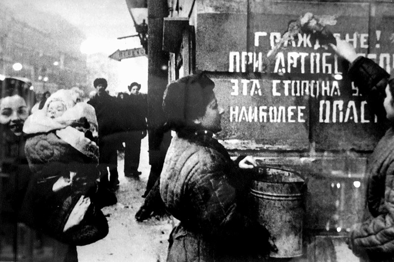 Exultant Leningrad. The siege is lifted. Sign on the wall says: Citizens! This part of the street is most dangerous during the artillery barrage, Russia