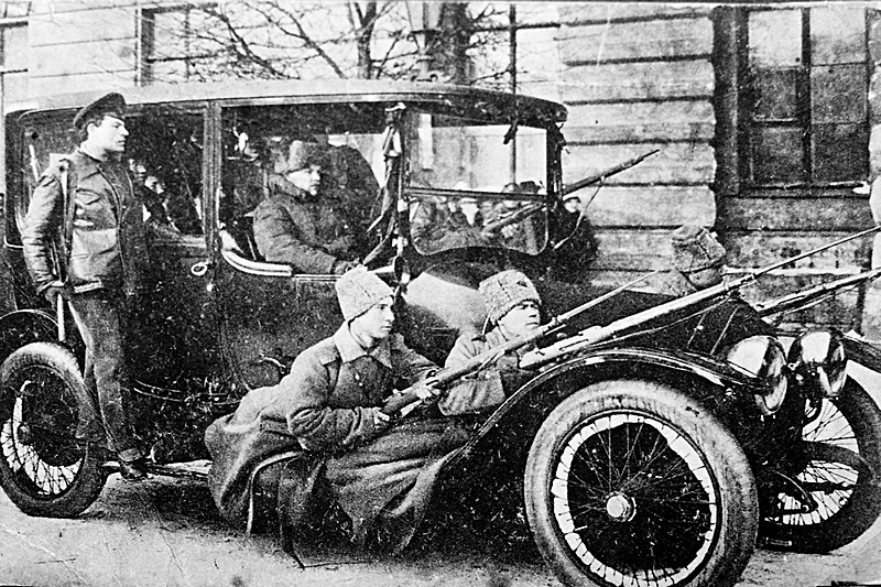 Car with armed soldiers and members of the city police in Petrograd, 1917, Russia