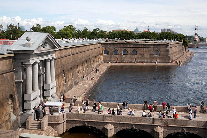 Visitors on the pier at the Peter and Paul Fortress in St Petersburg, Russia