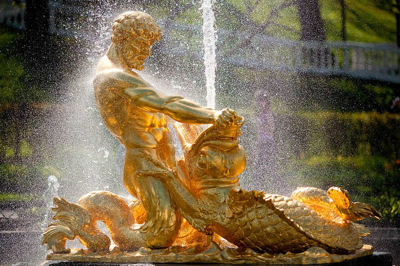 Oranzhereiny Fountain depicting a triton grappling with the jaws of sea monster in Peterhof, St Petersburg, Russia
